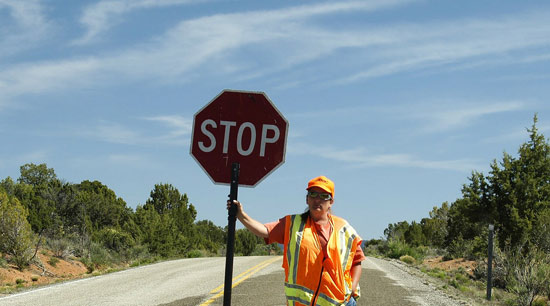 Highway driving safety work zone flagger